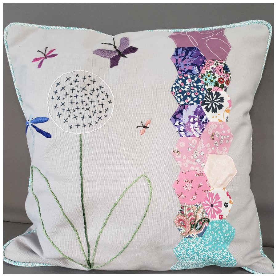 Embroidered pillow with hexagonal scrap pieces fabric